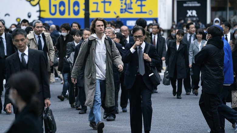 Ansel Elgort walking in Tokyo Vice