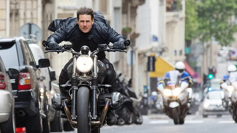 Ethan Hunt rides through paris on a motorbike in Mission: Impossible