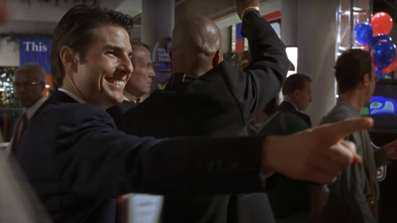 Tom Cruise's Jerry Maguire points and smiles in Jerry Maguire