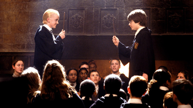 Draco and Harry dueling in Harry Potter and the Chamber of Secrets