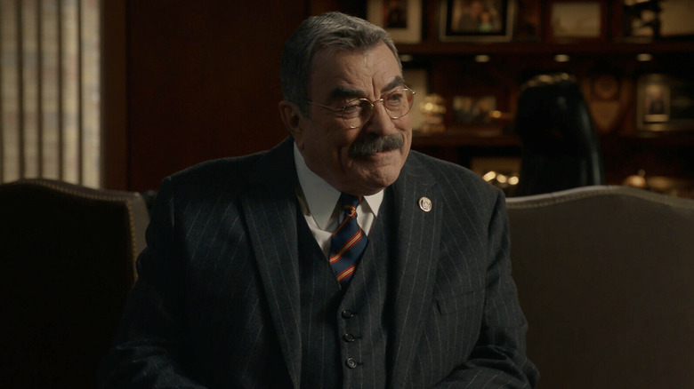 Tom Selleck as Frank Reagan sitting on a chair in the Blue Bloods episode Life Sentence