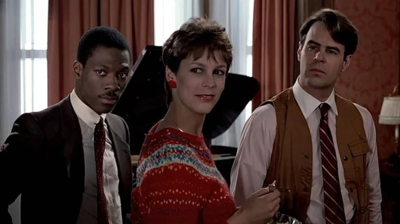 Valentine, Ophelia and Winthorpe standing in front of piano in Trading Places