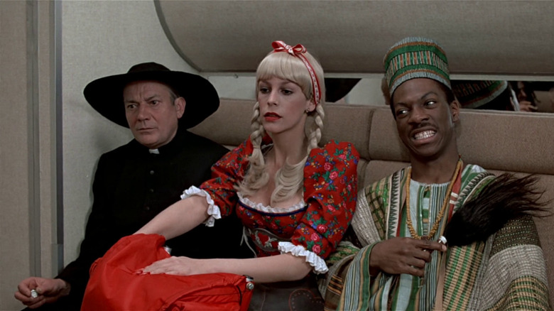 Coleman, Ophelia and Valentine sitting on train in disguises