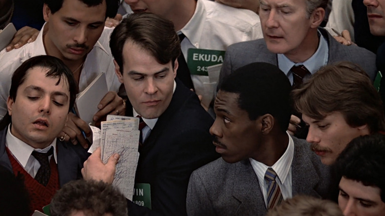 Winthorpe and Valentine standing on stock market floor in Trading Places