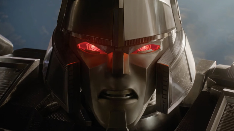 Transformers One Megatron/D-16 red eyes close-up "I'm done saving you"