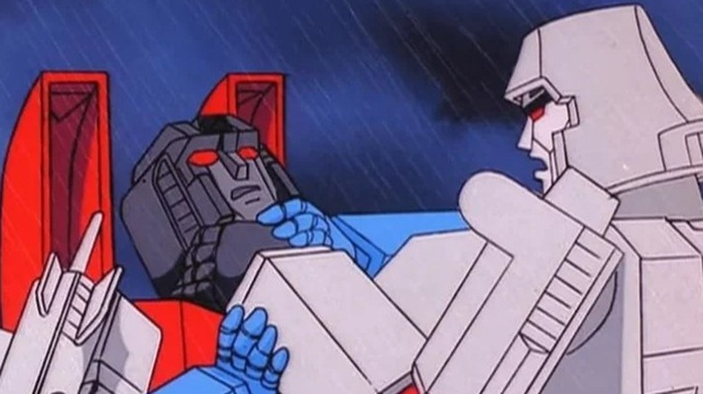 Transformers 1984 Megatron sufoca Starscream