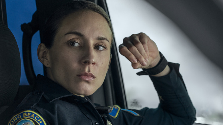 Troian Bellisario's Traci Harmon wearing a police uniform on On Call