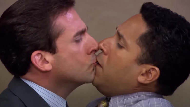 Michael Scott kissing Oscar Martinez in The Office