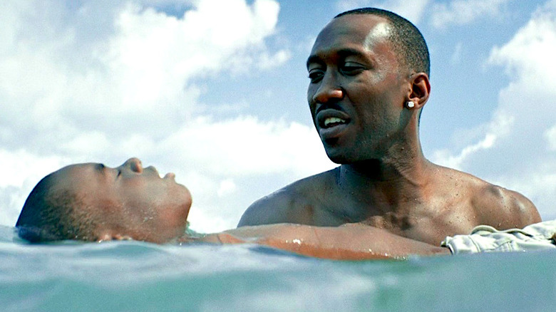 Alex Hibbert and Mahershala Ali swim in the ocean in Moonlight