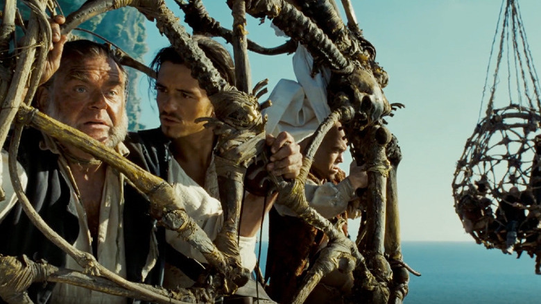 Kevin McNally and Orlando Bloom in Pirates of the Caribbean: Dead Man's Chest