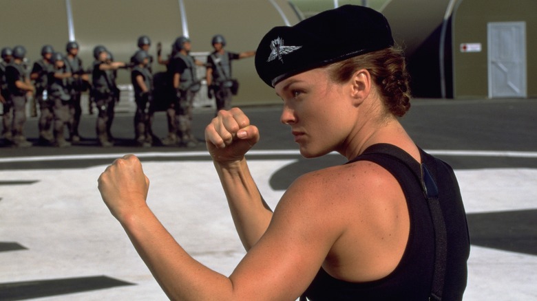 Dina Meyer raising fists