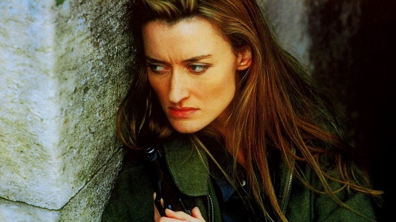 Natascha McElhone holding gun