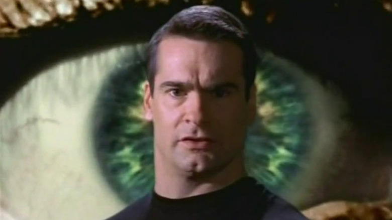 Henry Rollins in front of eyeball backdrop Night Visions