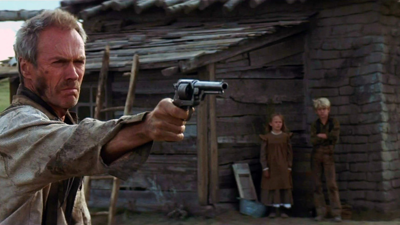 Unforgiven William Munny trying to shoot can as kids look on