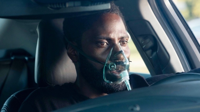 John David Washington wearing a breathing mask in Tenet