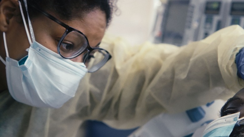 A doctor examines a patient