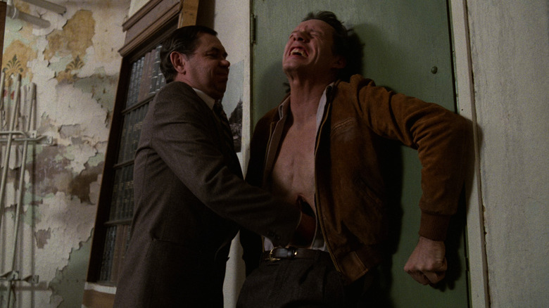 Les Carlson and James Woods in Videodrome