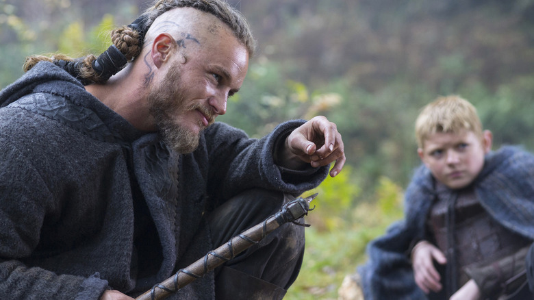Travis Fimmel as Ragnar Lothbrok and Nathan O'Toole as Bjorn in Vikings