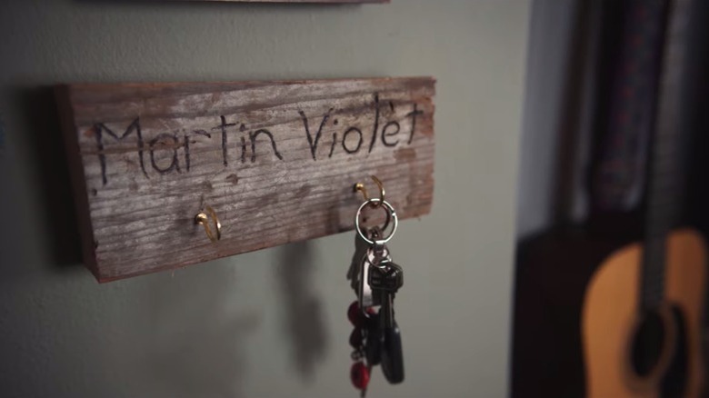 Keys dangle from a hook with Violet's name on it