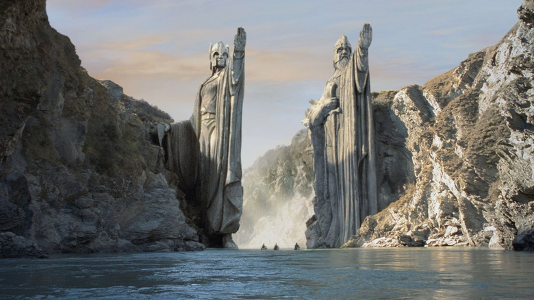 Giant statues on either side of the mouth of a waterfall in The Lord of the Rings: The Fellowship of the Ring