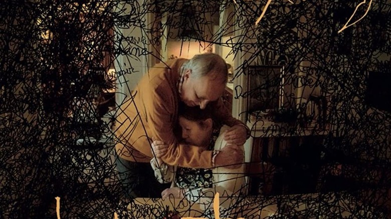 dario argento hugging françoise lebrun in the movie vortex surrounded by black scribbles