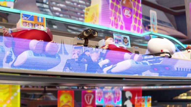 WALL-E in the Axiom surrounded by screens in WALL-E