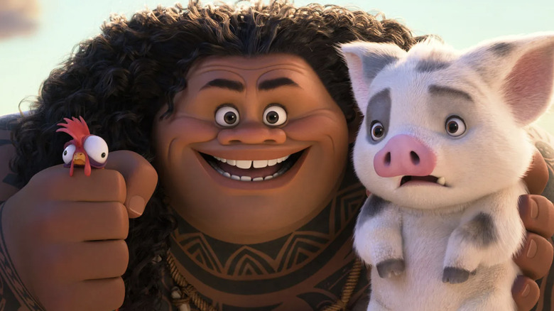 Maui holding Heihei the rooster in his fist and a scared Pua the pig in his other hand in Moana 2