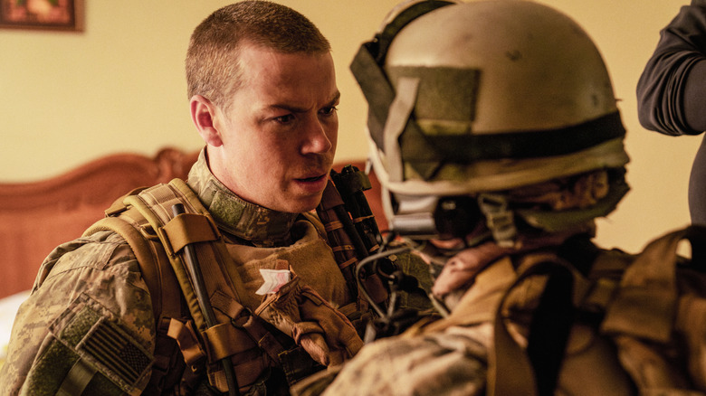 Will Poulter as a soldier named Erik sharing a tense moment with another member of the squad in Warfare