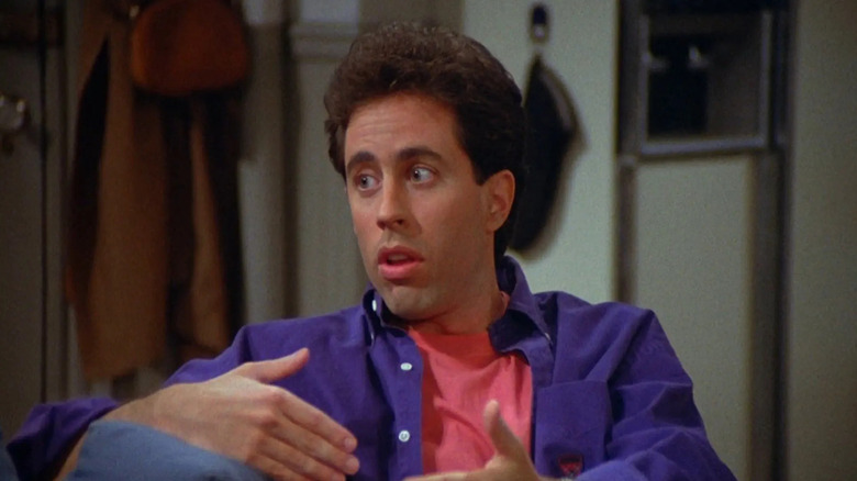 Jerry Seinfeld gesturing with his hands on Seinfeld