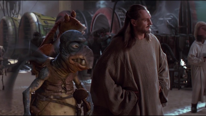 Andrew Secombe, Ahmed Best, and Liam Neeson in The Phantom Menace