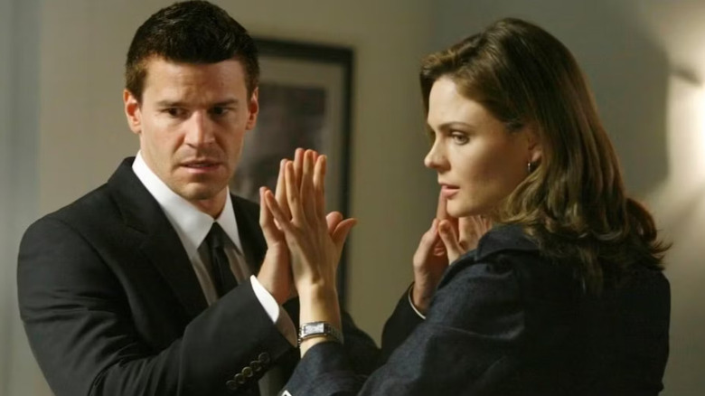 Booth and Bones touching hands Bones