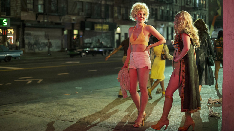 Eileen posing on a street corner with Lori on The Deuce