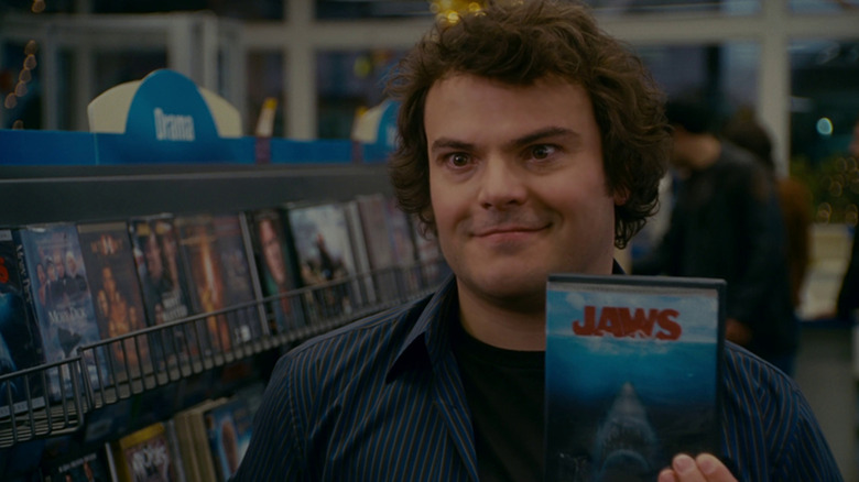 Miles holding up a DVD of Jaws in the movie The Holiday.