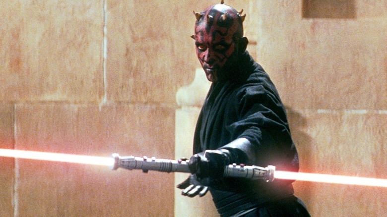 Darth Maul ignites red lightsaber on Naboo