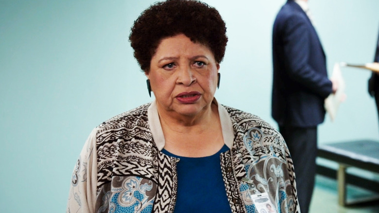 Patricia Belcher's Caroline Julian stands looking concerned in Bones