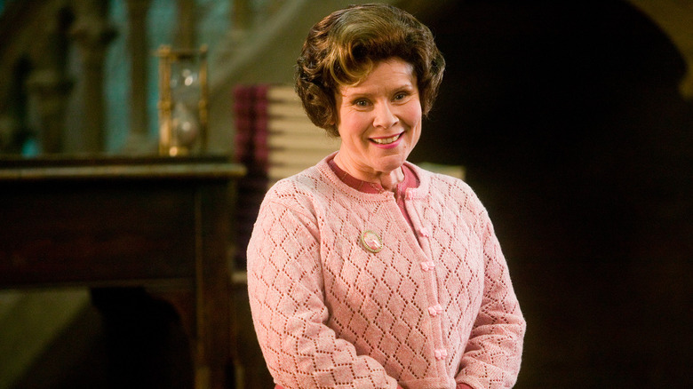 Umbridge smiling while giving a speech in Harry Potter and the Order of the Phoenix