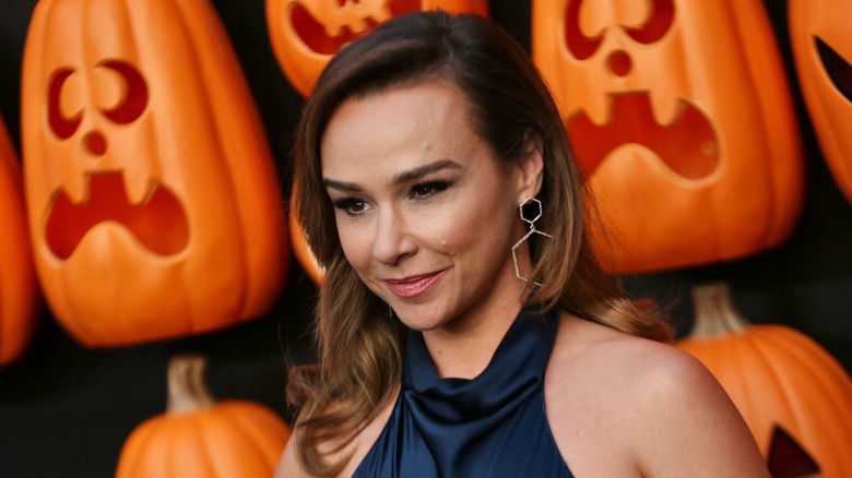 Danielle Harris at a wall of pumpkins