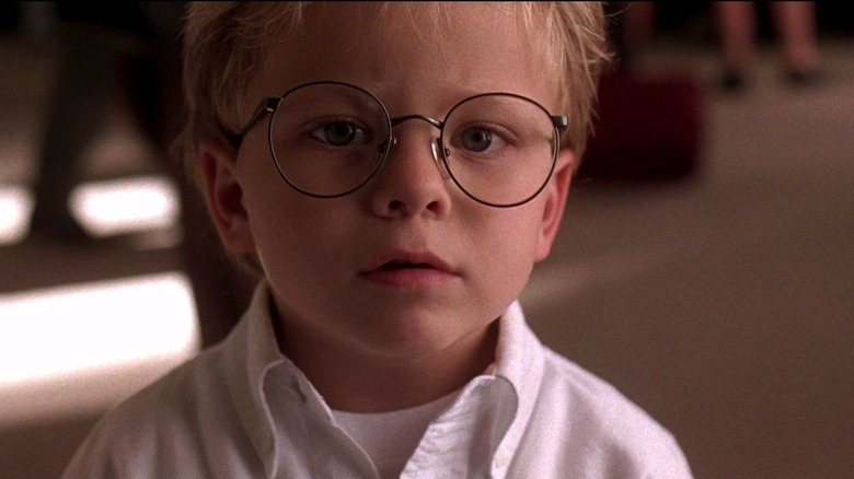 A close-up of Ray, with round glasses and a curious expression, in Jerry Maguire.