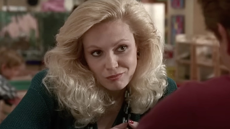 Cathy Moriarty as Sylvester's Mother smirks in Kindergarten Cop