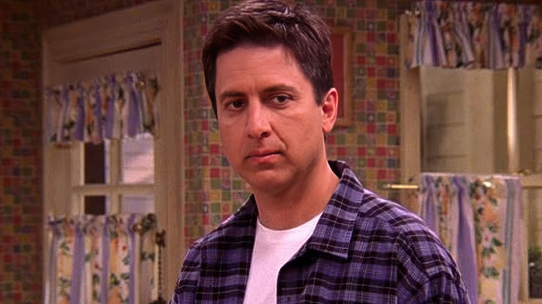 Ray Romano as Ray Barone stands in his kitchen on Everybody Loves Raymond