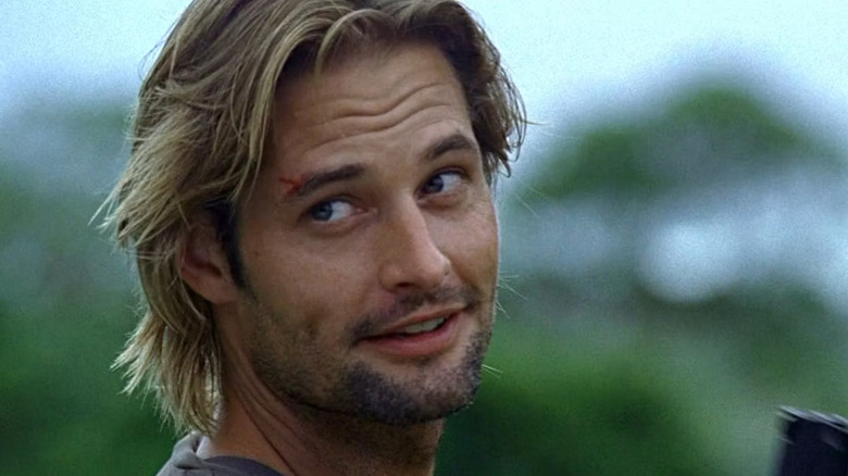 Sawyer looking over shoulder smirking Lost