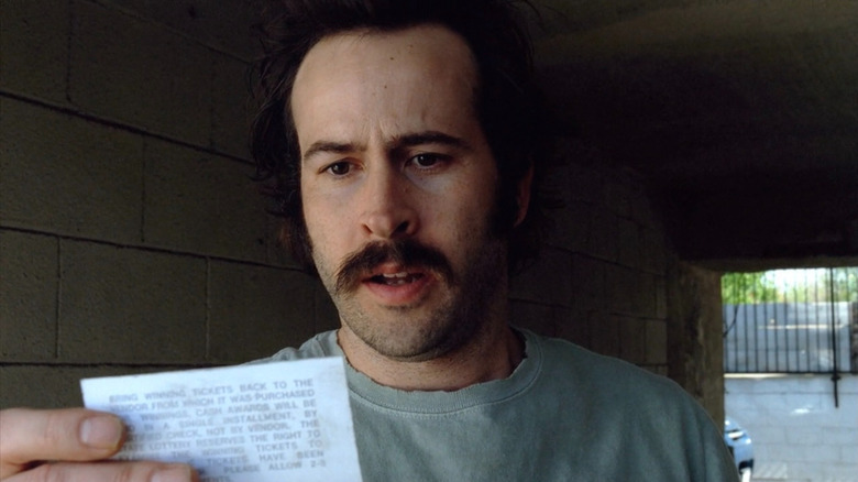 Jason Lee as Earl holding up lottery ticket on My Name Is Earl