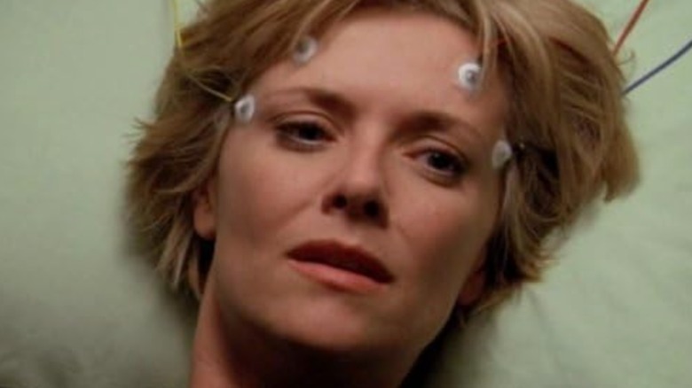 Amanda Tapping's Dr. Carter with electrodes on her head in Stargate SG-1