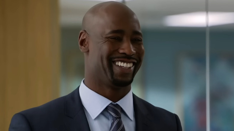 D.B. Woodside as Jeff Malone laughing in an office on Suits