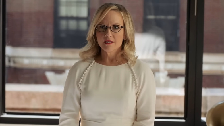 Rachael Harris as Sheila Sazs looking concerned in her office on Suits