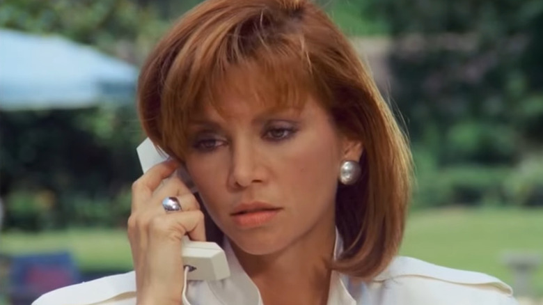 Victoria Principal as Pamela Barnes Ewing, taking a phone call on Dallas