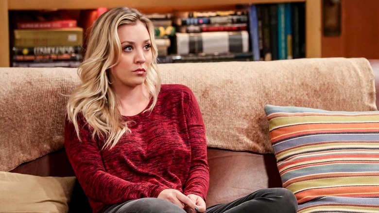 Penny sitting on a couch on The Big Bang Theory