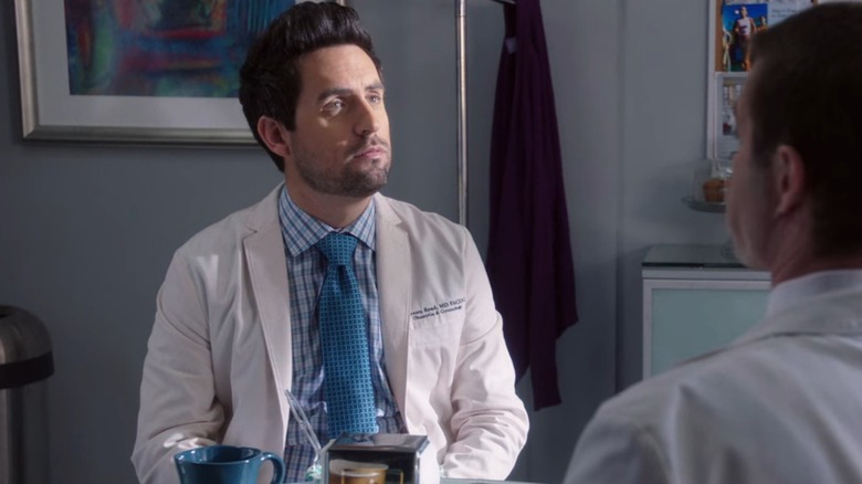 Dr. Jeremy Reed (Ed Weeks) in the breakroom, looking up into the light, on The Mindy Project