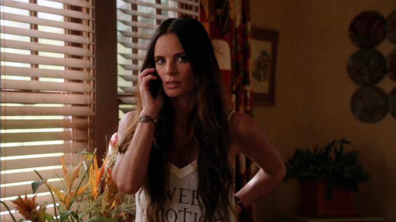 Gabrielle Anwar as Fiona talking on the phone in Burn Notice