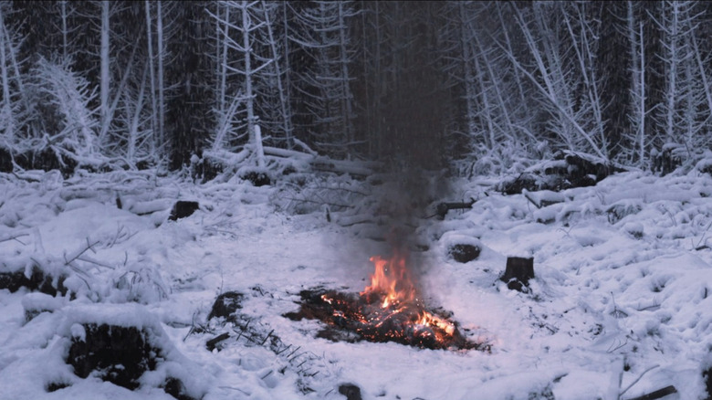 A figure burning in the snow in Under the Skin